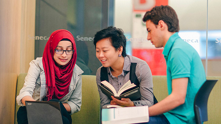 A group of diverse students studying language together.